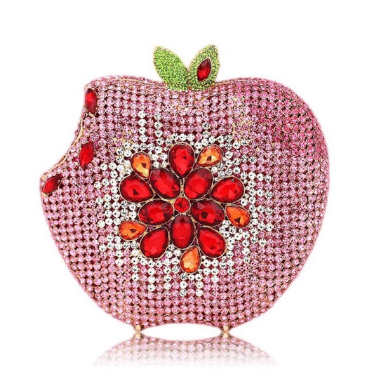 Add a pop of whimsy and style to your outfit with our Rhinestone Apple Shaped Handbag! Available in 8 vibrant colors, this playful clutch features a detailed rhinestone apple design and a convenient chain shoulder strap. Perfect for any fashionista looking to make a statement! (No worms included.)