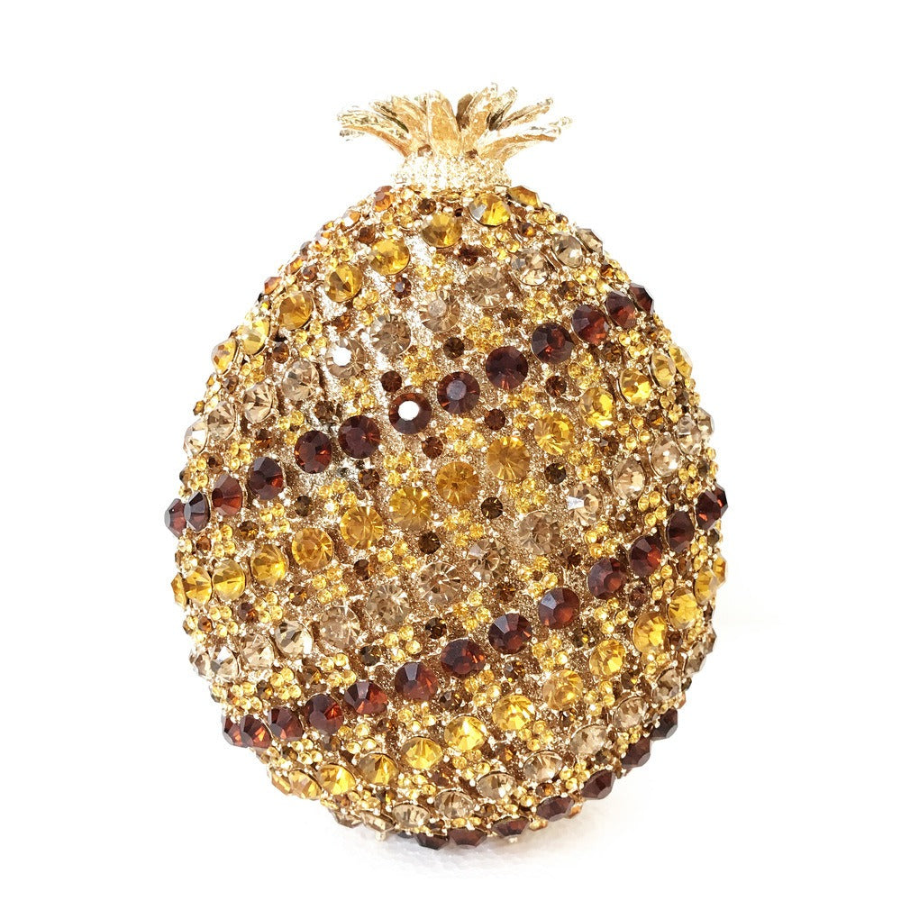 Indulge in the luxurious elegance of our Fruit pineapple shaped crystal banquet bag! Featuring a stunning diamond inlay and rhinestone details, this clutch bag exudes sophistication and glamour. With a convenient chain shoulder strap, it comes in both red and gold for the perfect touch of color. Elevate any outfit with this must-have accessory.