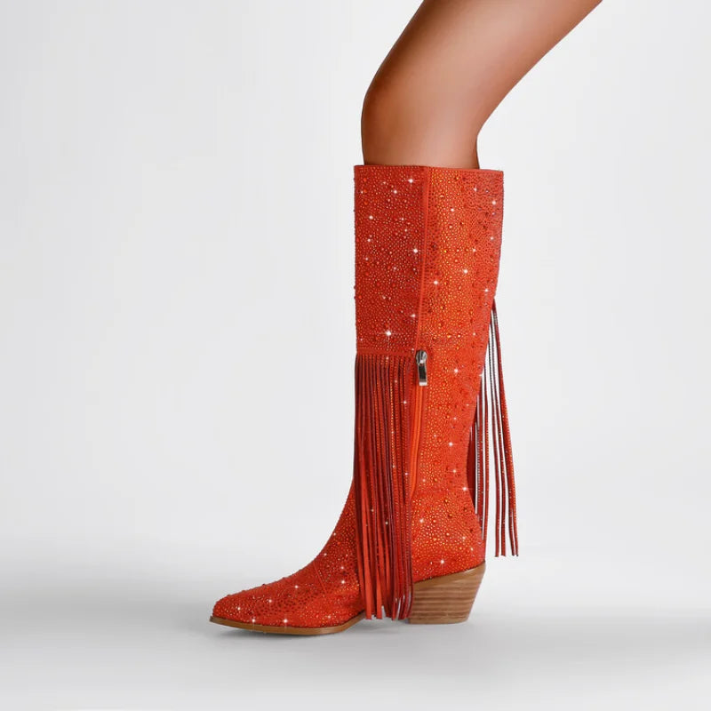 Elevate your western style with our Knee High Rhinestone Boots! Available in 3 stunning colors, these boots feature rhinestones and tassels that will add a touch of sparkle to any outfit. Perfect for all occasions, they will make you stand out and feel confident. Upgrade your wardrobe with these must-have boots.