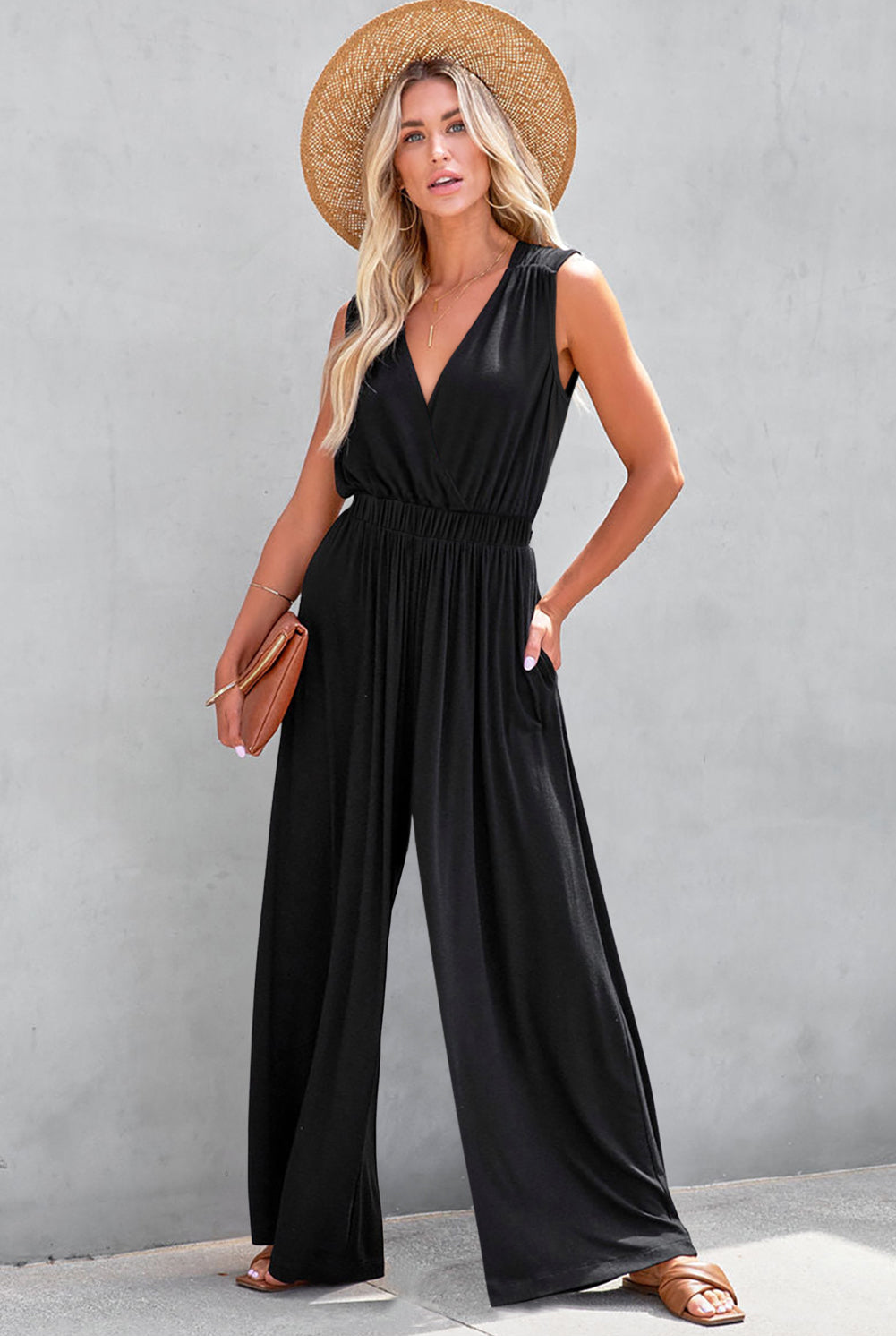 Get ready to turn heads with our Black Deep V Neck Pleated Crisscross Wide Leg Casual Backless Jumpsuit! This chic and versatile piece features a trendy deep v neck and a unique crisscross design, while the pleated details and wide leg cut give it a flattering and stylish look. Perfect for any occasion, from a casual day out to a night out on the town!