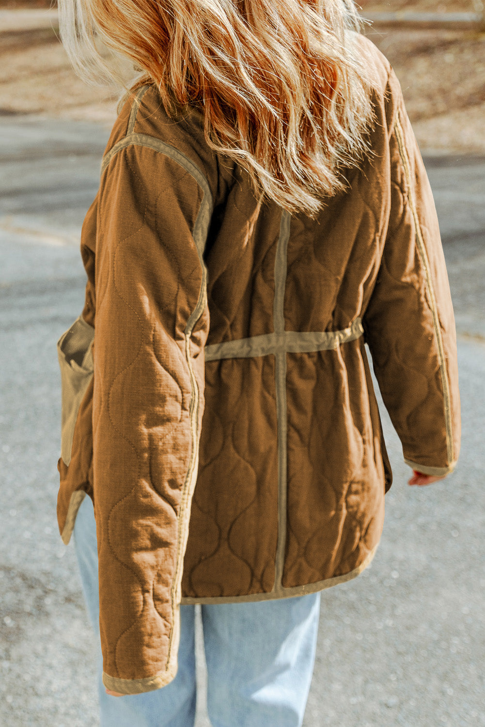 Stay warm and stylish with our Brown Stitching Quilted Drawstring Jacket. The high neck and drawstring provide excellent protection against the cold wind, while the zip-up design and pockets make it practical and easy to wear. Pair it with your favorite pants or jeans for a chic winter look.