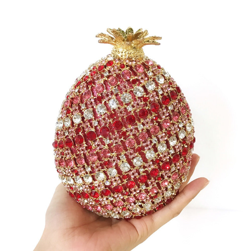 Indulge in the luxurious elegance of our Fruit pineapple shaped crystal banquet bag! Featuring a stunning diamond inlay and rhinestone details, this clutch bag exudes sophistication and glamour. With a convenient chain shoulder strap, it comes in both red and gold for the perfect touch of color. Elevate any outfit with this must-have accessory.