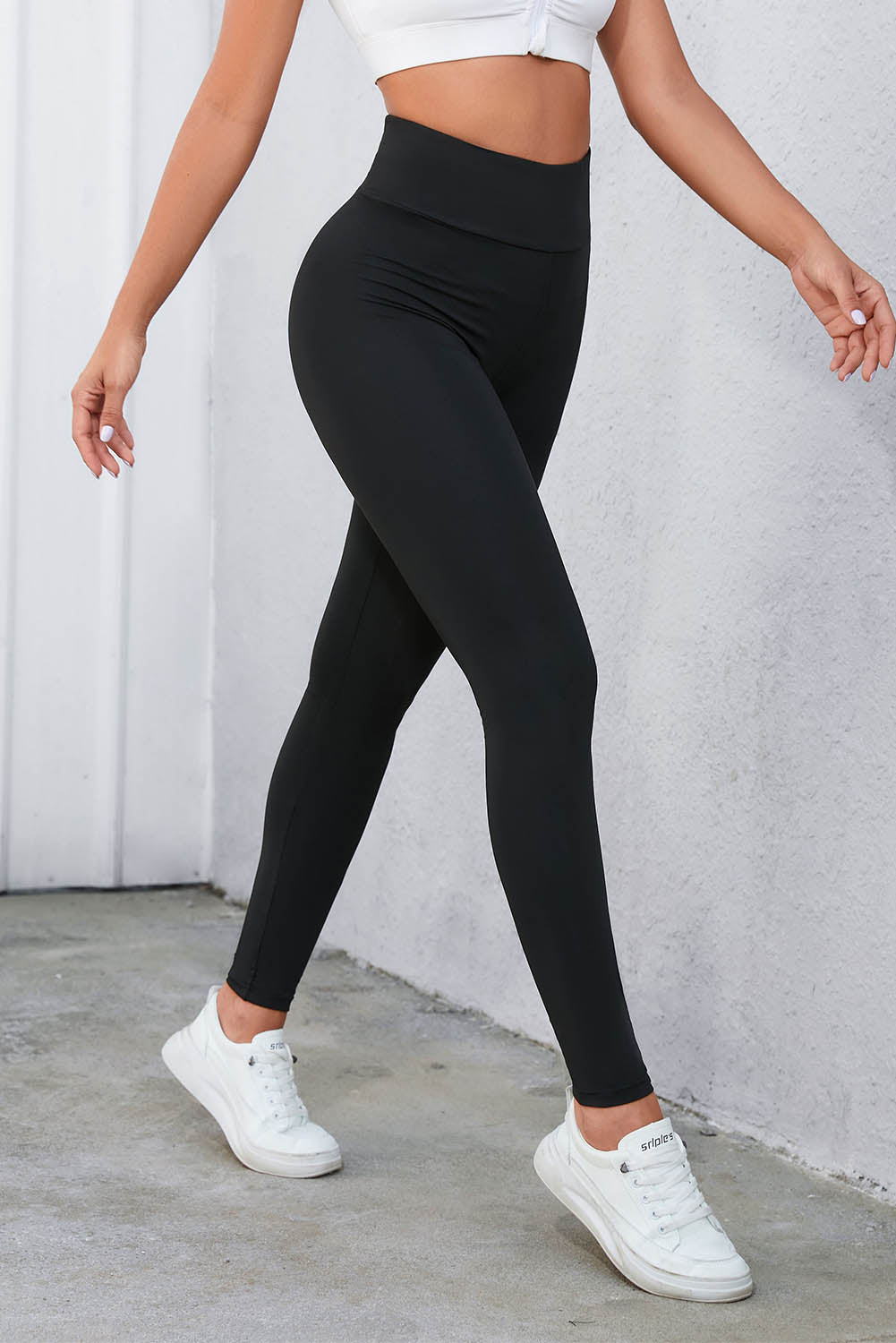 Flaunt your figure with our Black Criss Cross Tummy Control High Waist Leggings! Designed to give you a sleek and smooth silhouette, these leggings feature a high waist and criss cross detailing to enhance your curves and provide ultimate tummy control. Feel confident and comfortable all day long!