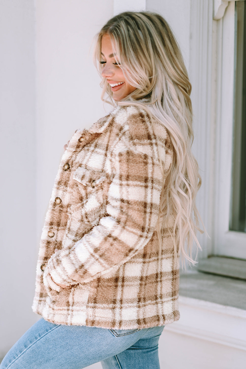 Stay warm and stylish with our Khaki Sherpa Plaid Button Pocketed Jacket. Made with soft sherpa, this jacket will keep you comfortable all day long. The spacious pockets allow for easy storage of essentials. Crafted with high-quality materials, you can count on this jacket to last. The classic plaid pattern and button front add a timeless touch to any outfit.