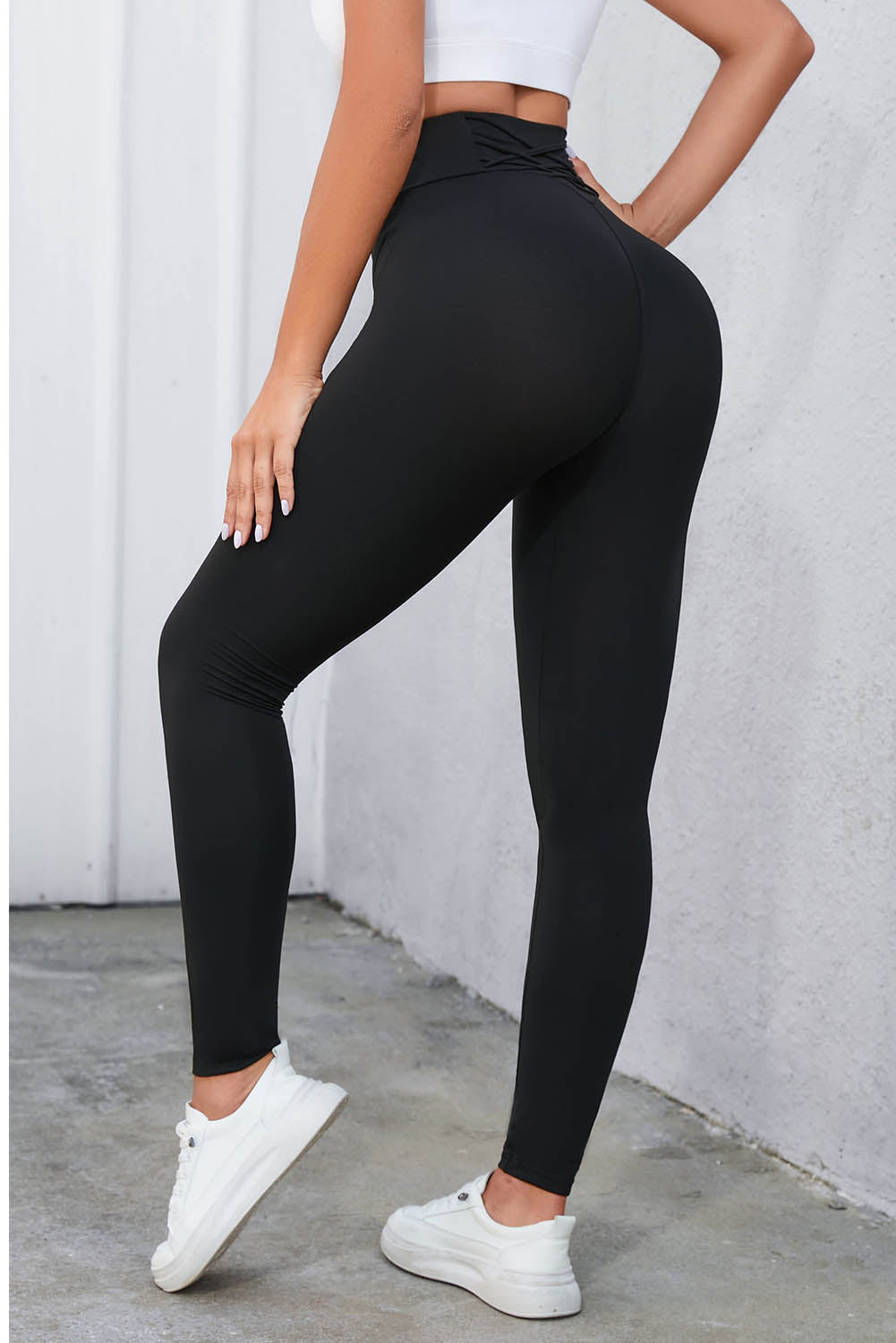 Flaunt your figure with our Black Criss Cross Tummy Control High Waist Leggings! Designed to give you a sleek and smooth silhouette, these leggings feature a high waist and criss cross detailing to enhance your curves and provide ultimate tummy control. Feel confident and comfortable all day long!