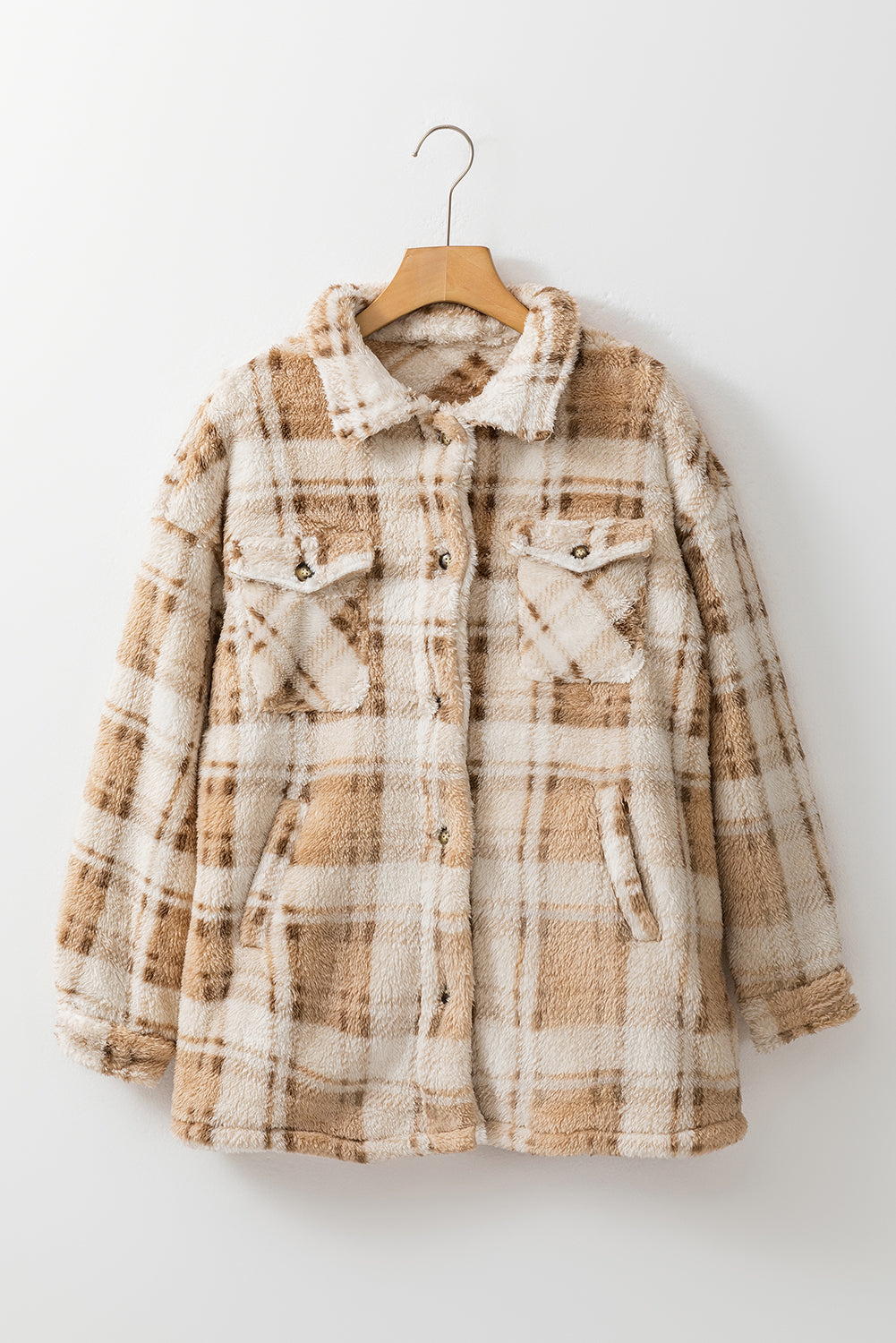 Stay warm and stylish with our Khaki Sherpa Plaid Button Pocketed Jacket. Made with soft sherpa, this jacket will keep you comfortable all day long. The spacious pockets allow for easy storage of essentials. Crafted with high-quality materials, you can count on this jacket to last. The classic plaid pattern and button front add a timeless touch to any outfit.