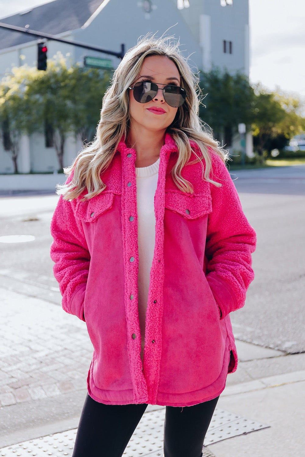 Introducing a cozy yet vibrant addition to your wardrobe: the Bright Pink Faux Suede Sherpa Button-Up Cardigan. Crafted with comfort and style in mind, this cardigan offers both warmth and flair, perfect for the modern woman who values both fashion and functionality