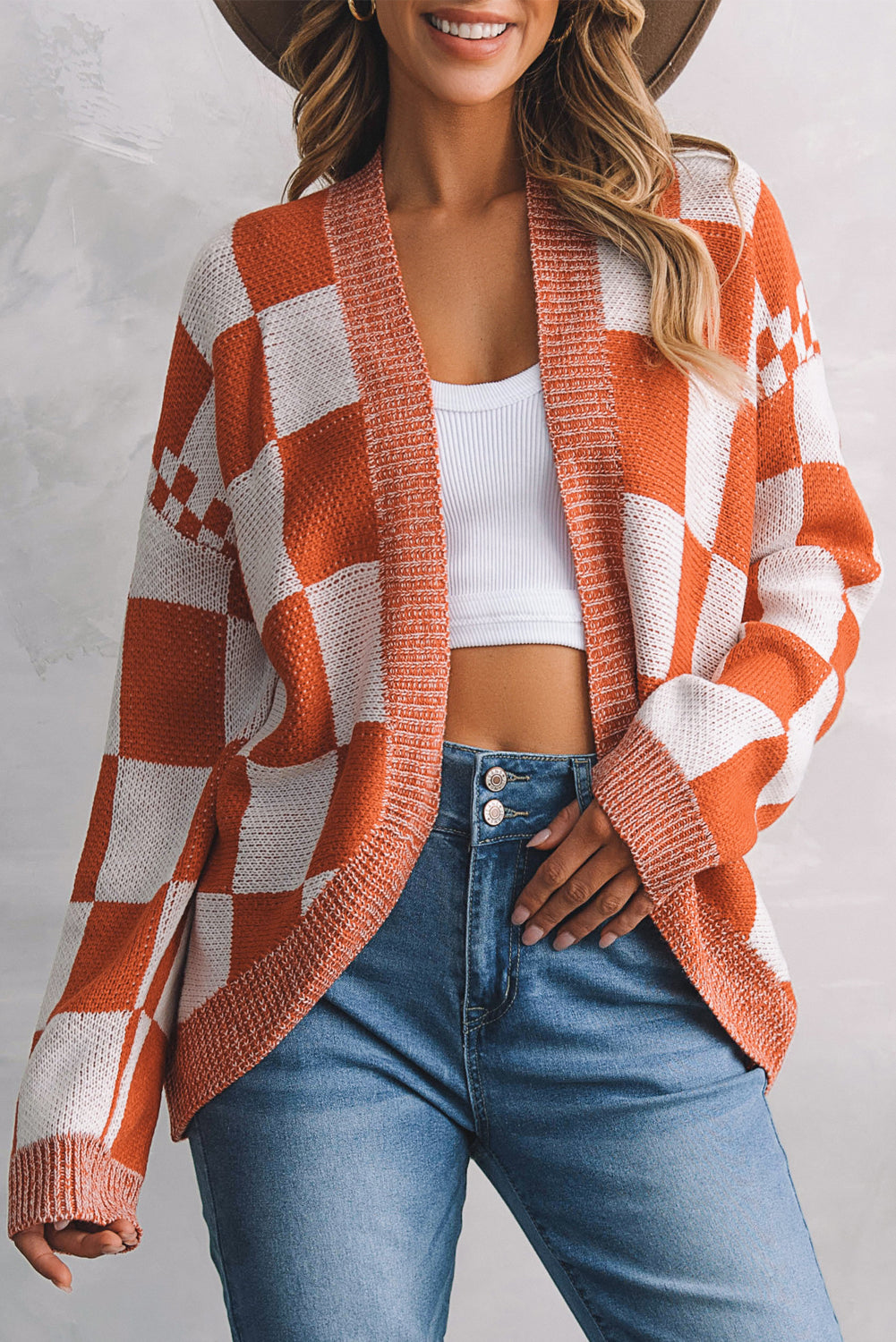 Introducing our Chestnut Mix Checkered Cardigan, a chic and classic addition to any wardrobe. Its checkered pattern is sure to make you fall in love with this knit coat. The open front design makes it easy to layer over any outfit, perfect for pairing with jeans, skirts, or dresses.