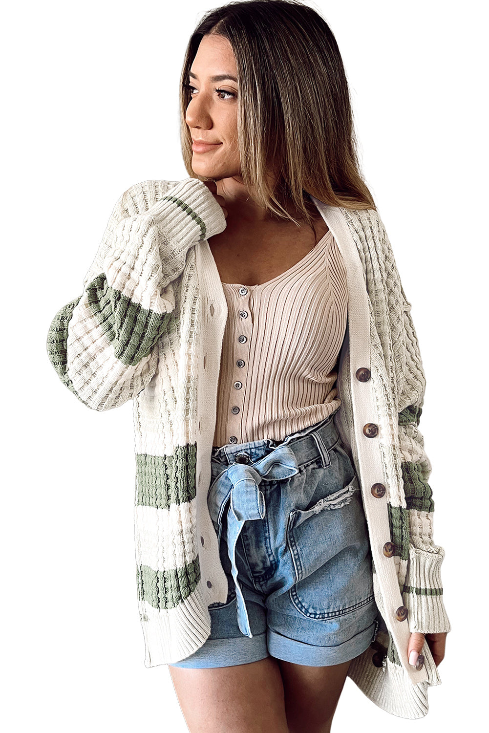 Get ready to add some color to your wardrobe with this Green Colorblock Textured Knit Buttoned Cardigan! The block-striped lightweight weave brings a playful touch to any outfit, while the rows of buttons down the front make for easy layering. Plus, the carefully knitted patterns and ribbed details add a touch of elegance to this quirky and fun cardigan.