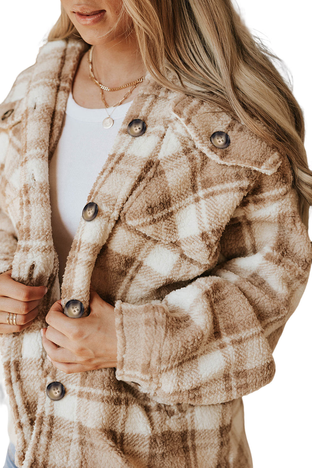 Stay warm and stylish with our Khaki Sherpa Plaid Button Pocketed Jacket. Made with soft sherpa, this jacket will keep you comfortable all day long. The spacious pockets allow for easy storage of essentials. Crafted with high-quality materials, you can count on this jacket to last. The classic plaid pattern and button front add a timeless touch to any outfit.