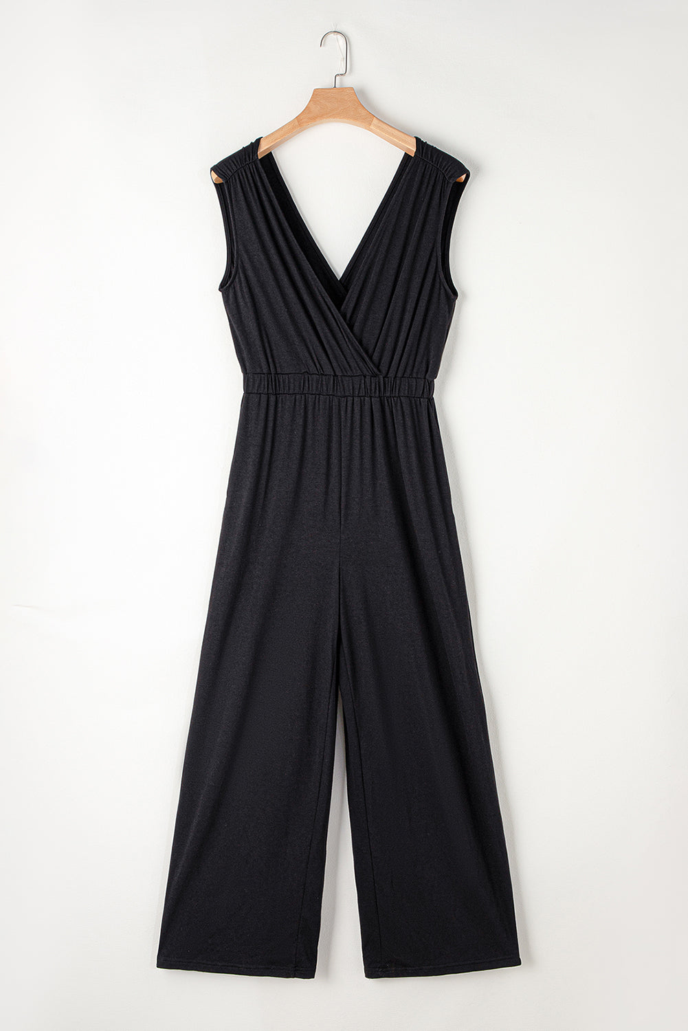 Get ready to turn heads with our Black Deep V Neck Pleated Crisscross Wide Leg Casual Backless Jumpsuit! This chic and versatile piece features a trendy deep v neck and a unique crisscross design, while the pleated details and wide leg cut give it a flattering and stylish look. Perfect for any occasion, from a casual day out to a night out on the town!