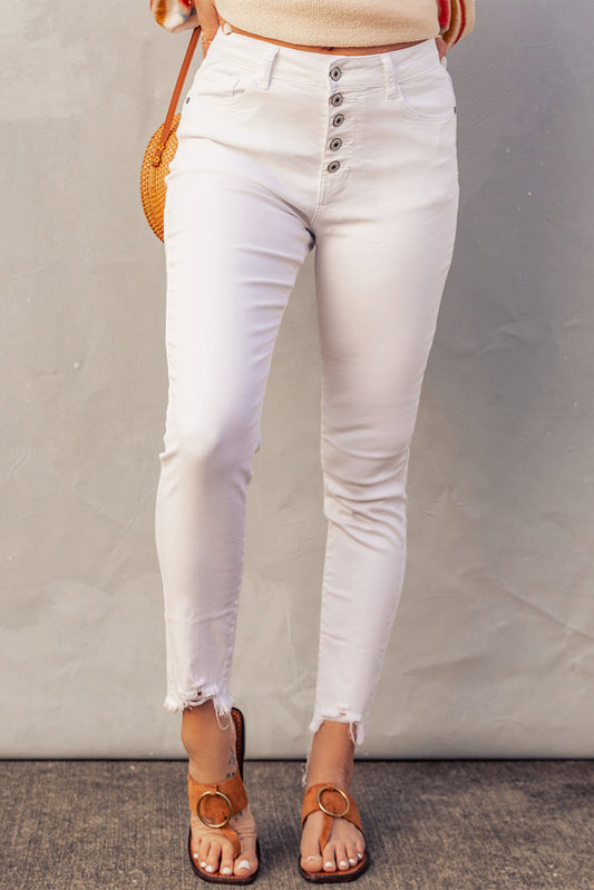 Elevate your denim game with our White Button High Waist Button Raw Edge Cropped Denim Jeans! These skinny jeans are designed to show off your sexy curves and elongate your legs, while the high waist provides comfort and functional pockets. Complete with a trendy cropped length and raw edge, these jeans are a must-have for any fashion-forward woman.