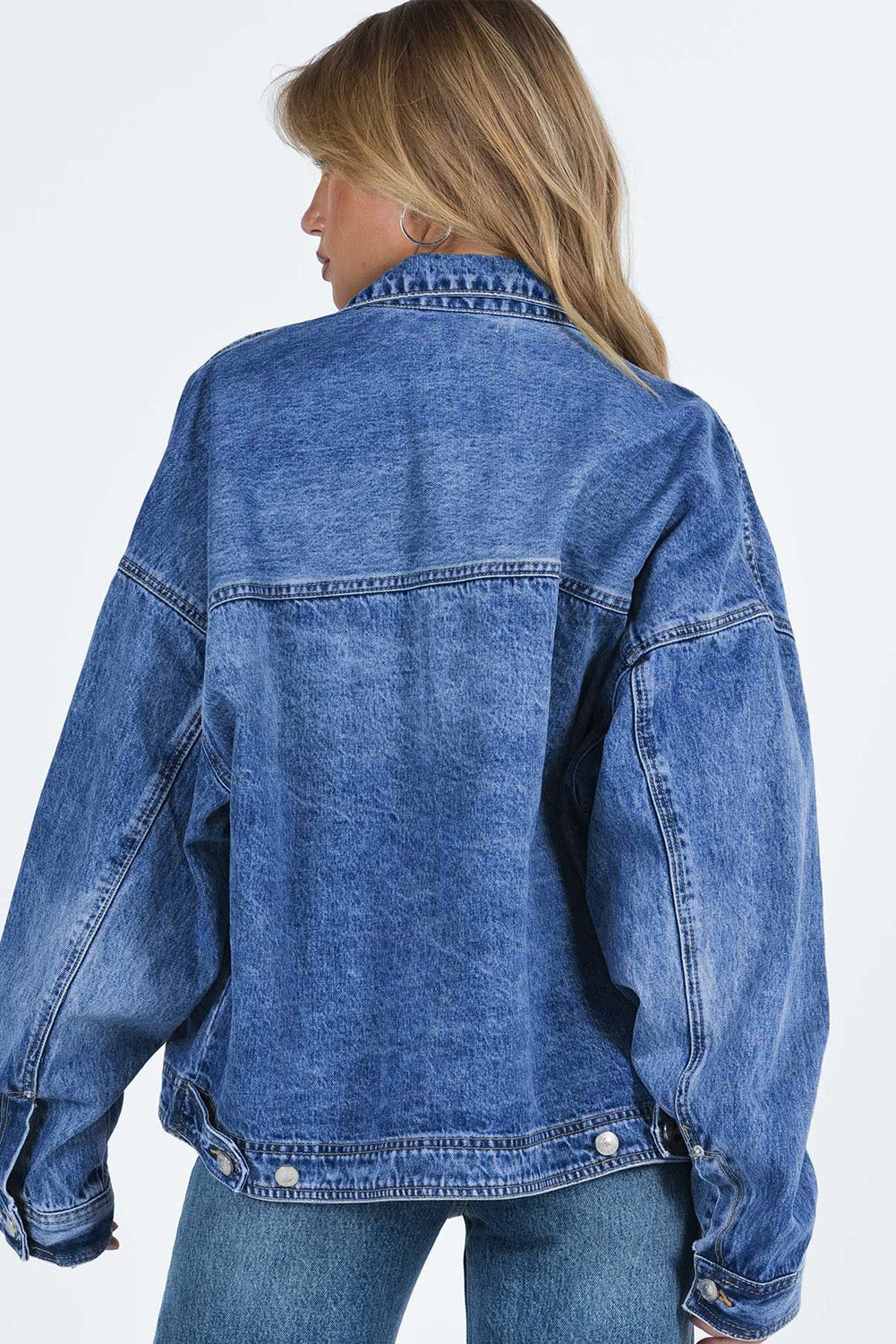 Get ready to drop it like it's hot in our Blue Chest Pockets Drop Shoulder Loose Denim Jacket! With its trendy oversized fit, convenient chest pockets, and unique dropped shoulder design, this jacket is perfect for a casual, yet stylish look. Say hello to your new favorite wardrobe staple, available now in blue denim.