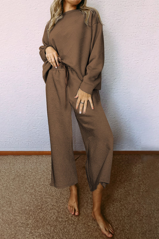 Get ready to loosen up and elevate your style with our Dark Brown Ultra Loose Fit Textured Outfit Set. This unique set features an ultra loose fit for maximum comfort, along with a textured design for a touch of personality. Perfect for a casual day out or lounging at home.