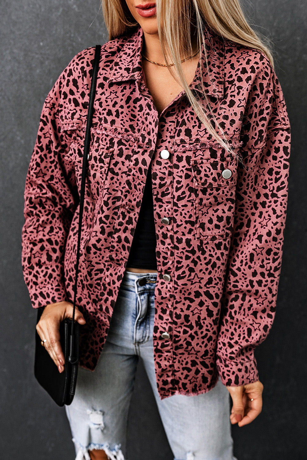 Unleash your wild side with our Pink Stars &amp; Animal Spots Print Button Up Denim Shacket. The leopard spot and heart and stars print adds a stylish touch, while the chest pockets make it practical. The distressed design keeps you on trend. Perfect for pairing with a crop top, t shirt, pants, sneakers, and other accessories.