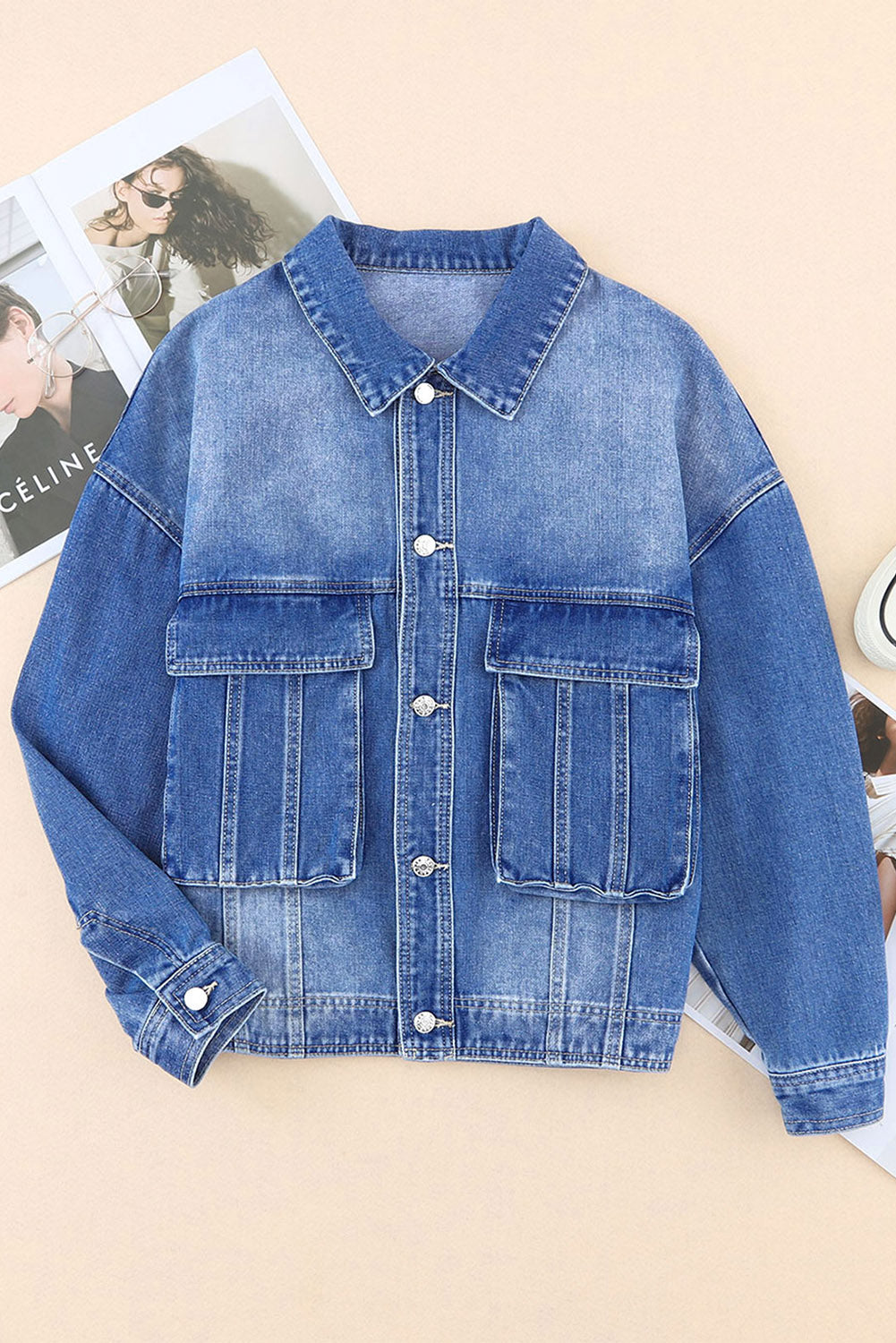 Get ready to drop it like it's hot in our Blue Chest Pockets Drop Shoulder Loose Denim Jacket! With its trendy oversized fit, convenient chest pockets, and unique dropped shoulder design, this jacket is perfect for a casual, yet stylish look. Say hello to your new favorite wardrobe staple, available now in blue denim.