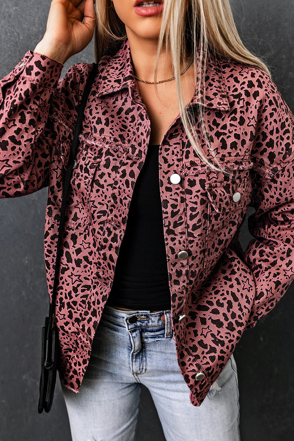 Unleash your wild side with our Pink Stars &amp; Animal Spots Print Button Up Denim Shacket. The leopard spot and heart and stars print adds a stylish touch, while the chest pockets make it practical. The distressed design keeps you on trend. Perfect for pairing with a crop top, t shirt, pants, sneakers, and other accessories.