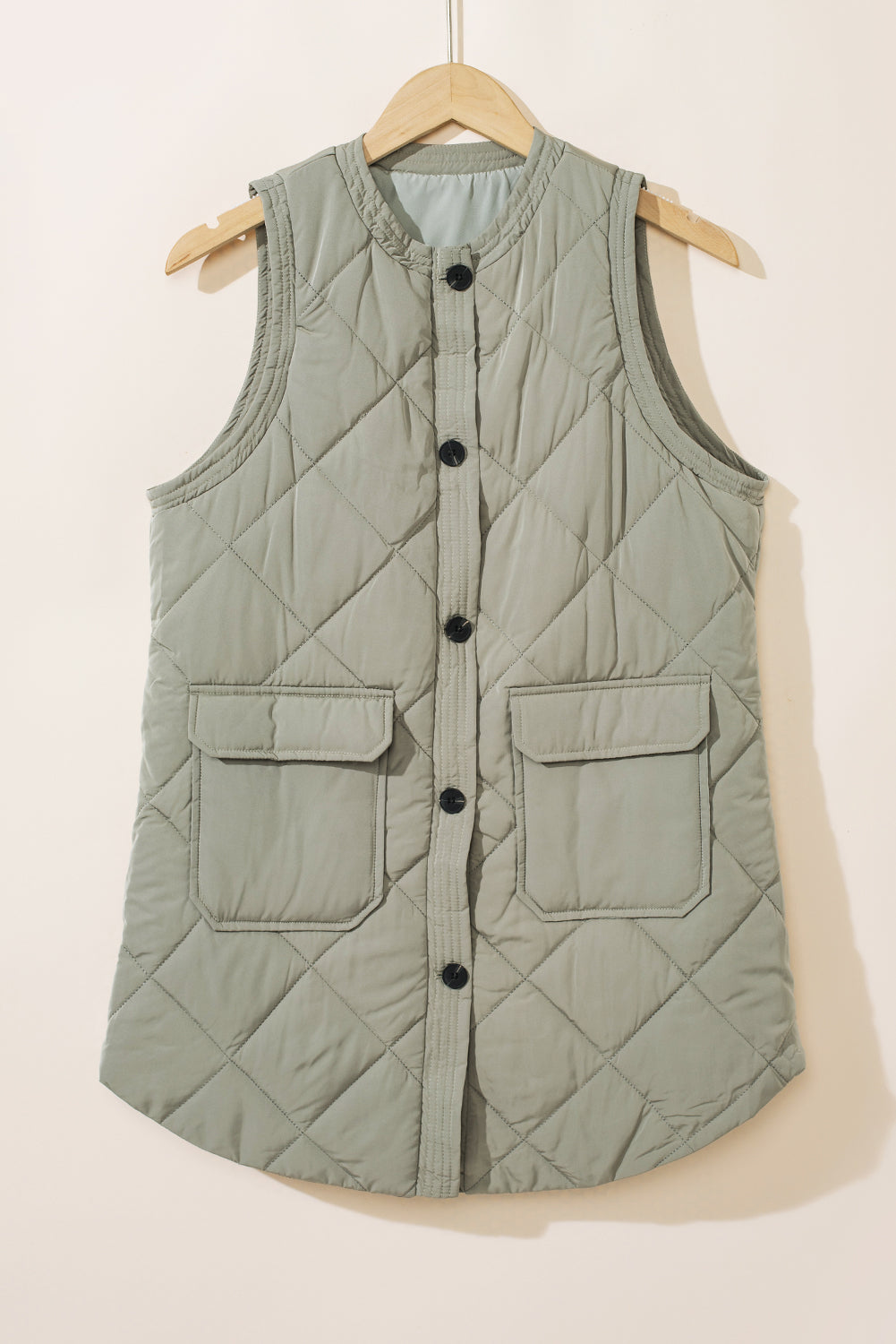 Elevate your style with our Grass Green Quilted Long Vest Jacket with Pockets! Made with premium quilted fabric, this vest offers both fashion and function. Stay warm and stylish with its longer length and convenient pockets. Perfect for any occasion, our vest is a must-have addition to your wardrobe.