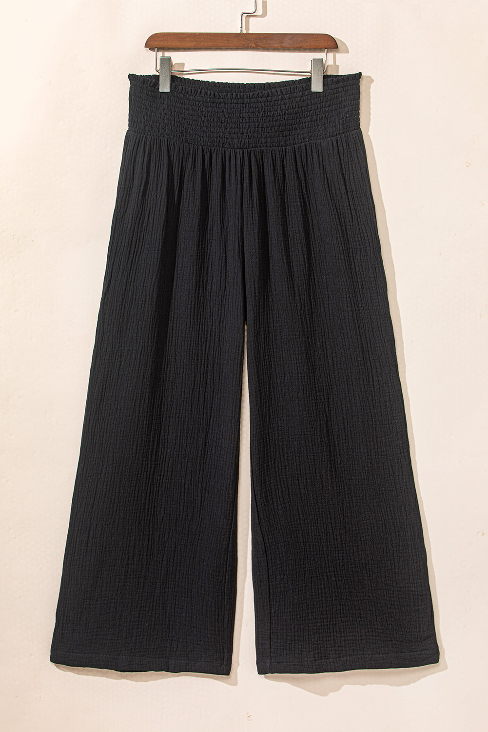 Elevate your style with our Black Textured High Waist Wide Leg Plus Size Pants! These pants feature a flattering high waist design and wide leg fit, providing comfort and confidence. Perfect for any occasion, these pants will have you feeling chic and stylish.