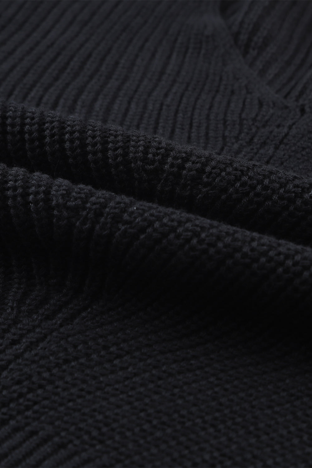 Cozy up in style with our Black Ribbed Knit V Neck Sweater. Made with a soft and stretchy ribbed knit fabric, this sweater features a flattering v neck design. Perfect for pairing with jeans or leggings, it's a versatile and stylish addition to any wardrobe.