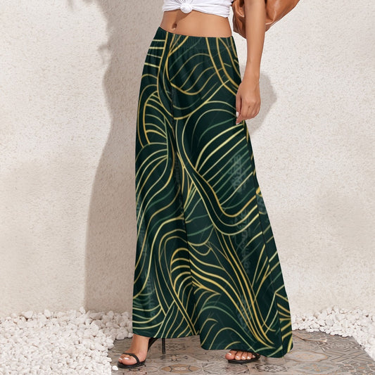 Elevate your style with our Green &amp; Gold Graphic Print Flowy Wide Leg Pants. The unique print adds a bold touch, while the flowy construction provides comfort and movement. Make a statement and turn heads with this must-have addition to your wardrobe.