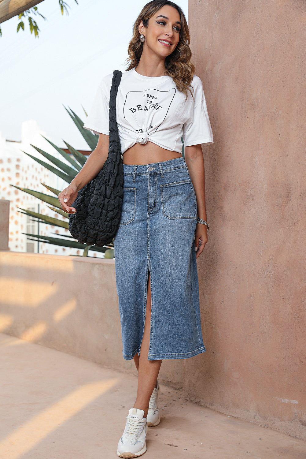 Elevate your wardrobe with our Classic Sky Blue Midi Denim Skirt! This stylish piece features a front slit and convenient pockets, adding a modern touch to the classic denim design. Perfect for any occasion, feel confident and fashionable in this must-have piece!