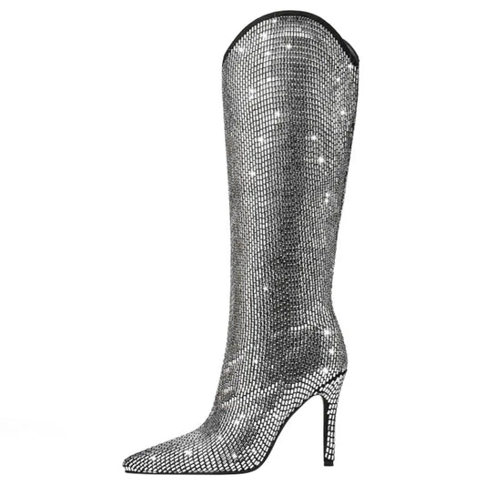 Step out in style with these dazzling Women's Silver Rhinestone Knee Length High Heel Boots! The perfect combination of fashion and function, these boots will elevate any outfit while providing all-day comfort. With stunning rhinestone details and a sleek knee-length design, these boots are a must-have for any fashionable woman.