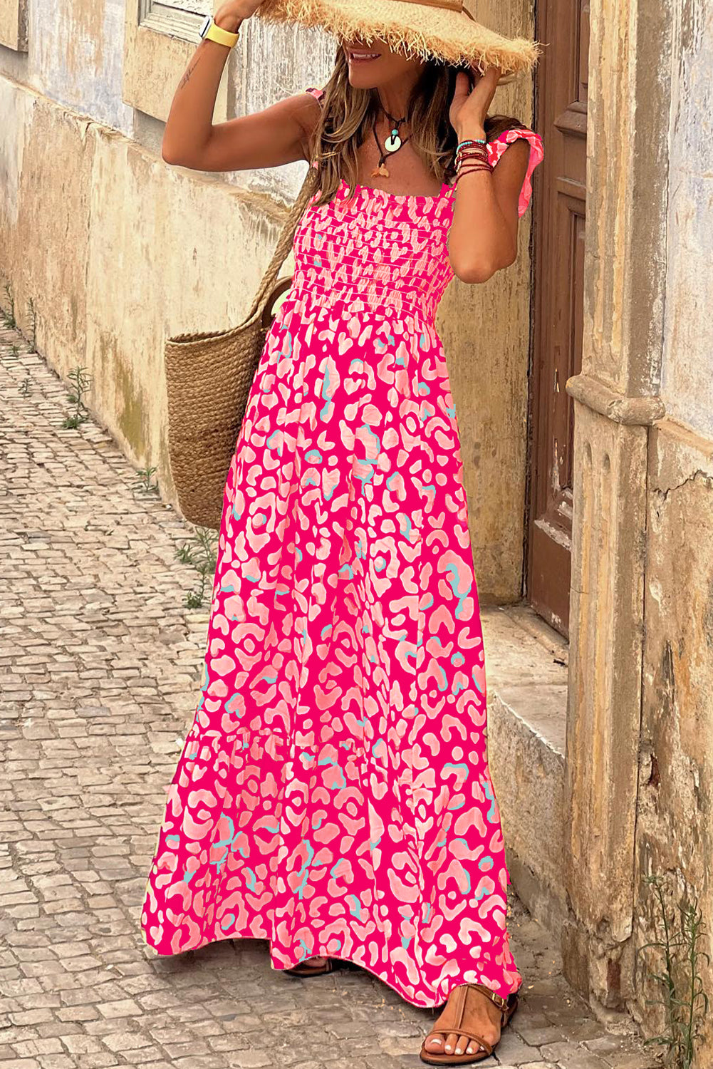 Indulge in the fierce yet feminine style of our Pink Leopard Ruffle Straps Smocked High Waist Long Dress. With its playful ruffle straps and flattering smocked high waist design, this dress will have you feeling confident and stylish. The bold pink leopard print adds a touch of wildness to any occasion.