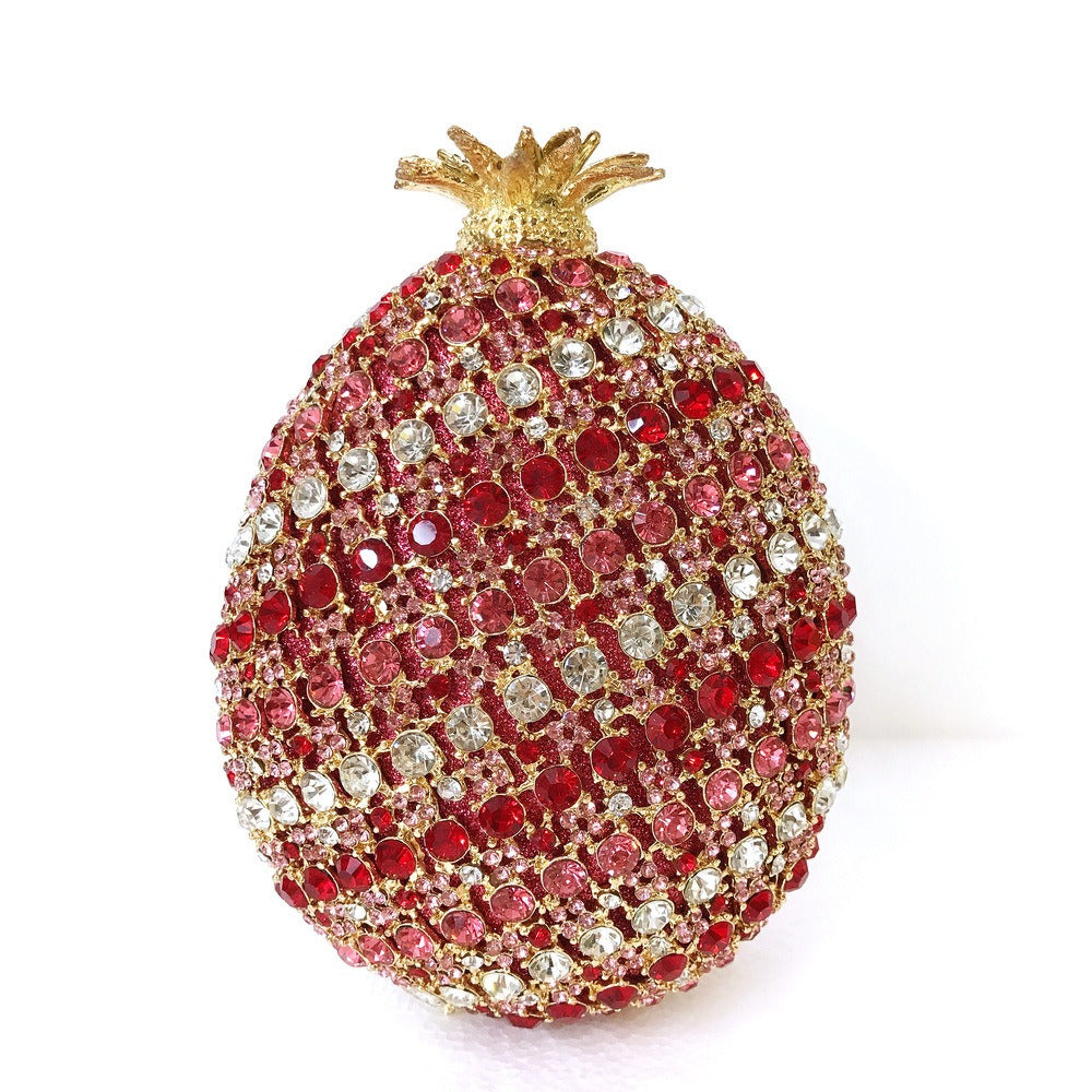 Indulge in the luxurious elegance of our Fruit pineapple shaped crystal banquet bag! Featuring a stunning diamond inlay and rhinestone details, this clutch bag exudes sophistication and glamour. With a convenient chain shoulder strap, it comes in both red and gold for the perfect touch of color. Elevate any outfit with this must-have accessory.