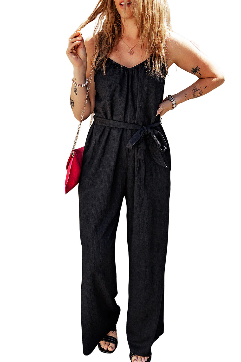 Elevate your style with our Black Textured Belted Wide Leg Sleeveless Jumpsuit. This elegant piece is designed to offer comfort and versatility, with its wide leg design and sleeveless top. The textured fabric and belted waist add a touch of sophistication, making it perfect for any occasion. Step out in style and turn heads wherever you go!