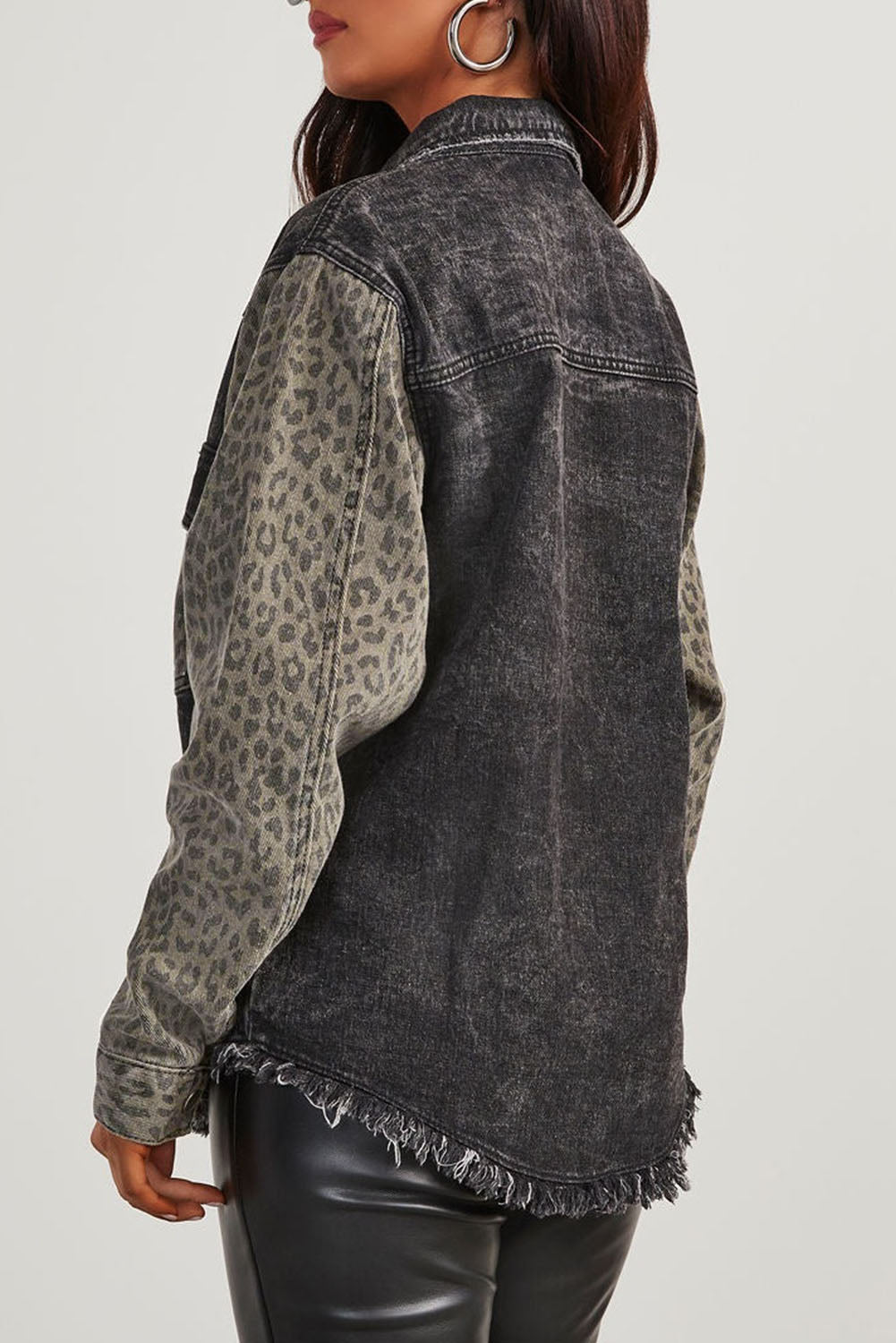 Show off your wild side with our Black Leopard Patch Pocket Vintage Raw Hem Denim Jacket! This unique piece features a playful leopard patch pocket and edgy raw hem, adding a touch of unconventional style to any outfit. You'll feel fierce and fun in this one-of-a-kind jacket!