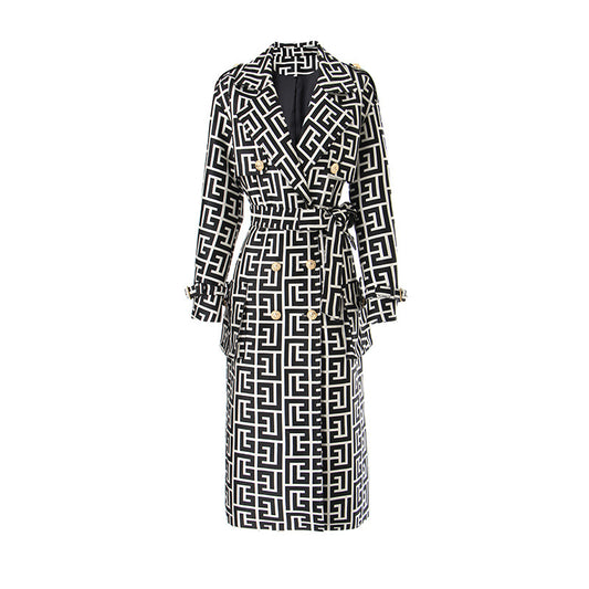 This stylish Women's Lined Trench Coat features a unique black and white geometric design with a double breasted front and cuff straps for a modern look. A wide lapel collar and tie closure add an elegant touch. Stay warm and fashionable in this versatile coat for any occasion!