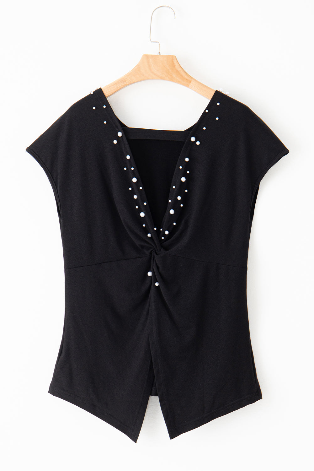 Looking for something that will add a touch of elegance to your casual wardrobe? Look no further than our Black Pearls Embellished Twist Back Tee! With a unique twist back design and glimmering black pearl embellishments, this tee is perfect for a playful and chic look.