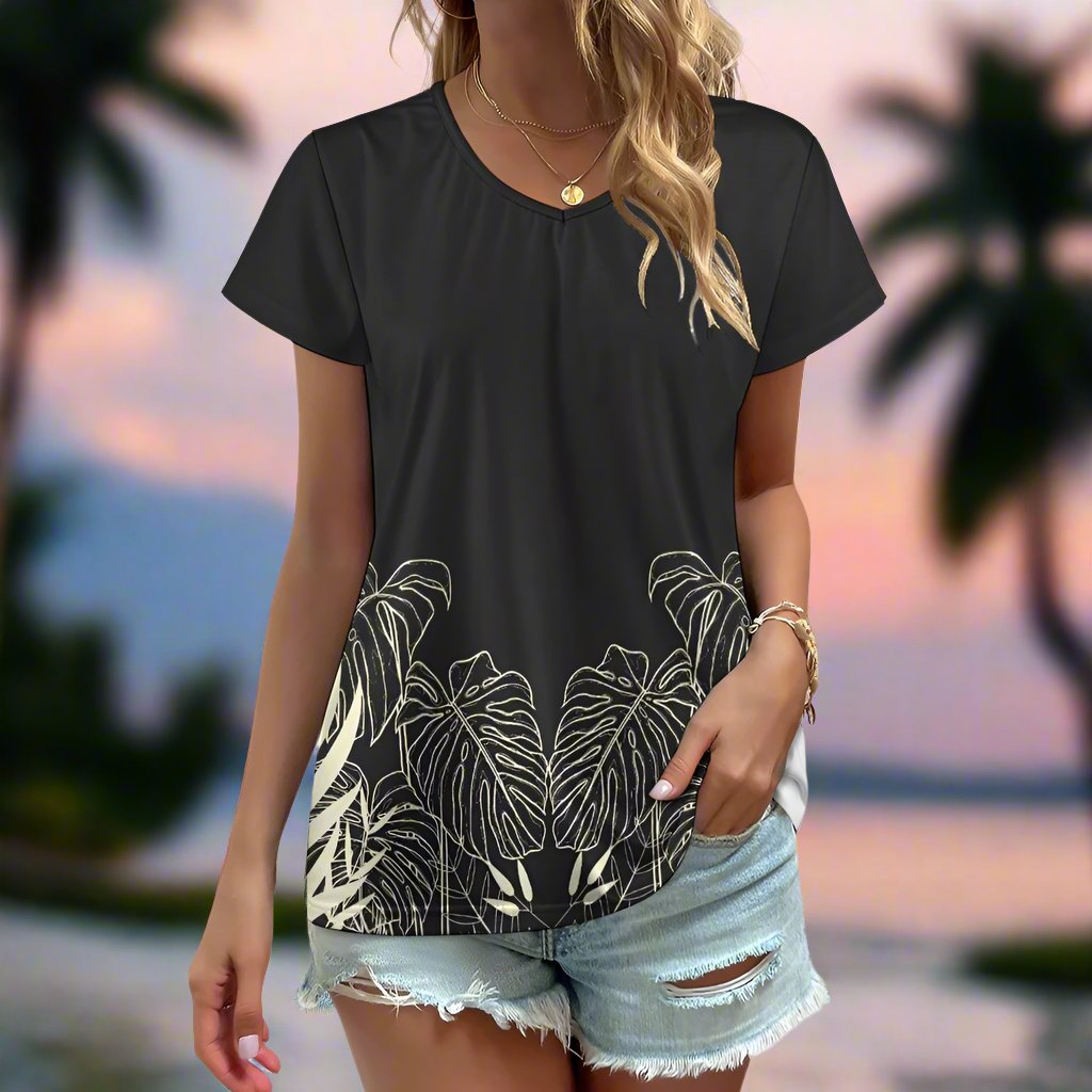 Stay effortlessly stylish and comfortable with our Black Designer Original Graphic Print V-Neck T-shirt! The tropical leaf print wrapping around just above the hemline adds a unique touch. Pair it with the matching slacks for a complete, chic look. Upgrade your wardrobe with this must-have piece!