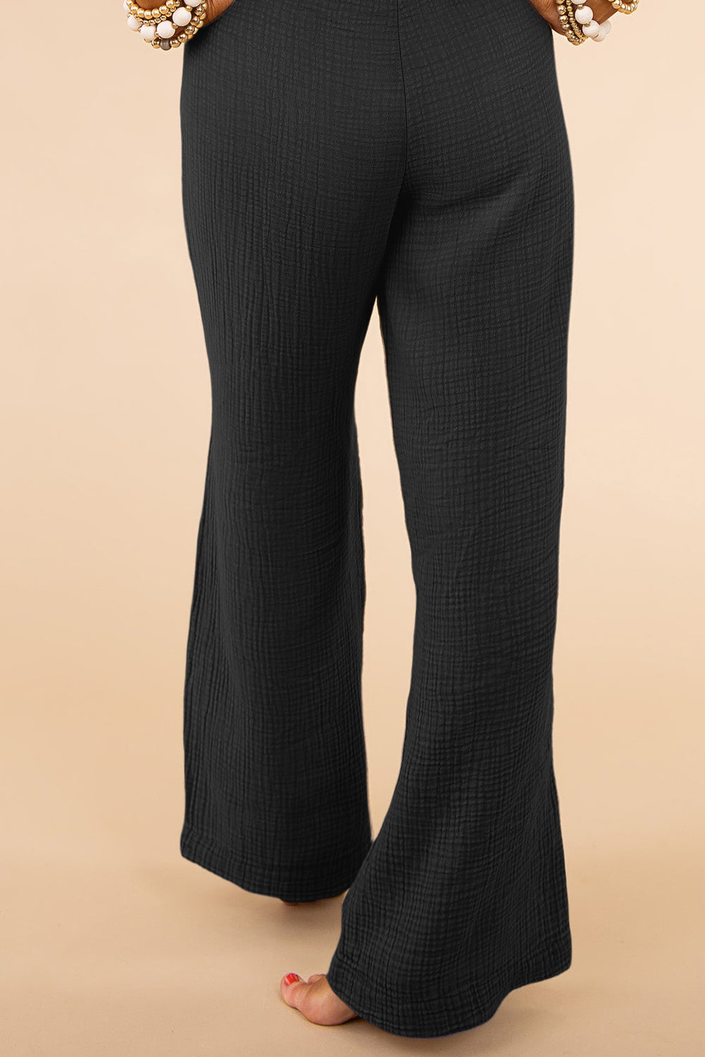 Elevate your style with our Black Textured High Waist Wide Leg Plus Size Pants! These pants feature a flattering high waist design and wide leg fit, providing comfort and confidence. Perfect for any occasion, these pants will have you feeling chic and stylish.