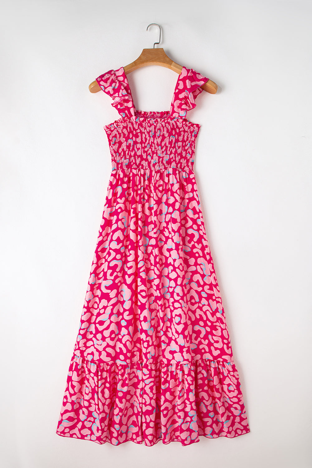 Indulge in the fierce yet feminine style of our Pink Leopard Ruffle Straps Smocked High Waist Long Dress. With its playful ruffle straps and flattering smocked high waist design, this dress will have you feeling confident and stylish. The bold pink leopard print adds a touch of wildness to any occasion.