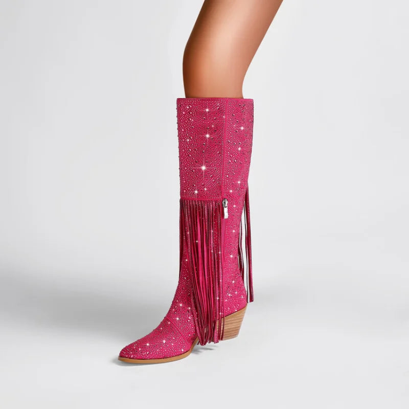 Elevate your western style with our Knee High Rhinestone Boots! Available in 3 stunning colors, these boots feature rhinestones and tassels that will add a touch of sparkle to any outfit. Perfect for all occasions, they will make you stand out and feel confident. Upgrade your wardrobe with these must-have boots.