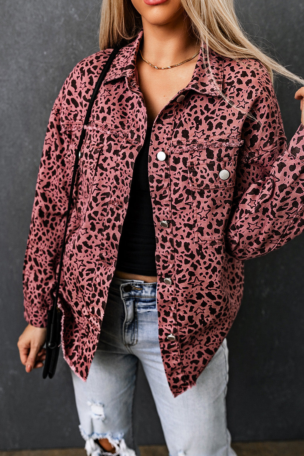 Unleash your wild side with our Pink Stars &amp; Animal Spots Print Button Up Denim Shacket. The leopard spot and heart and stars print adds a stylish touch, while the chest pockets make it practical. The distressed design keeps you on trend. Perfect for pairing with a crop top, t shirt, pants, sneakers, and other accessories.