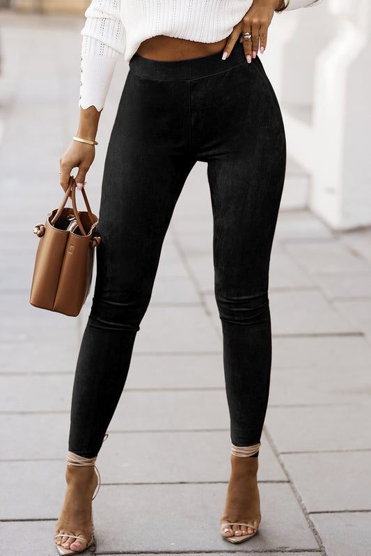 Introducing our Fashionable Black High Waist Faux Suede Skinny Leggings! Elevate your style with these comfortable and chic leggings. With a high waist design and faux suede material, you'll look and feel amazing. Perfect for any occasion, these leggings are a must-have for any fashion-forward wardrobe.