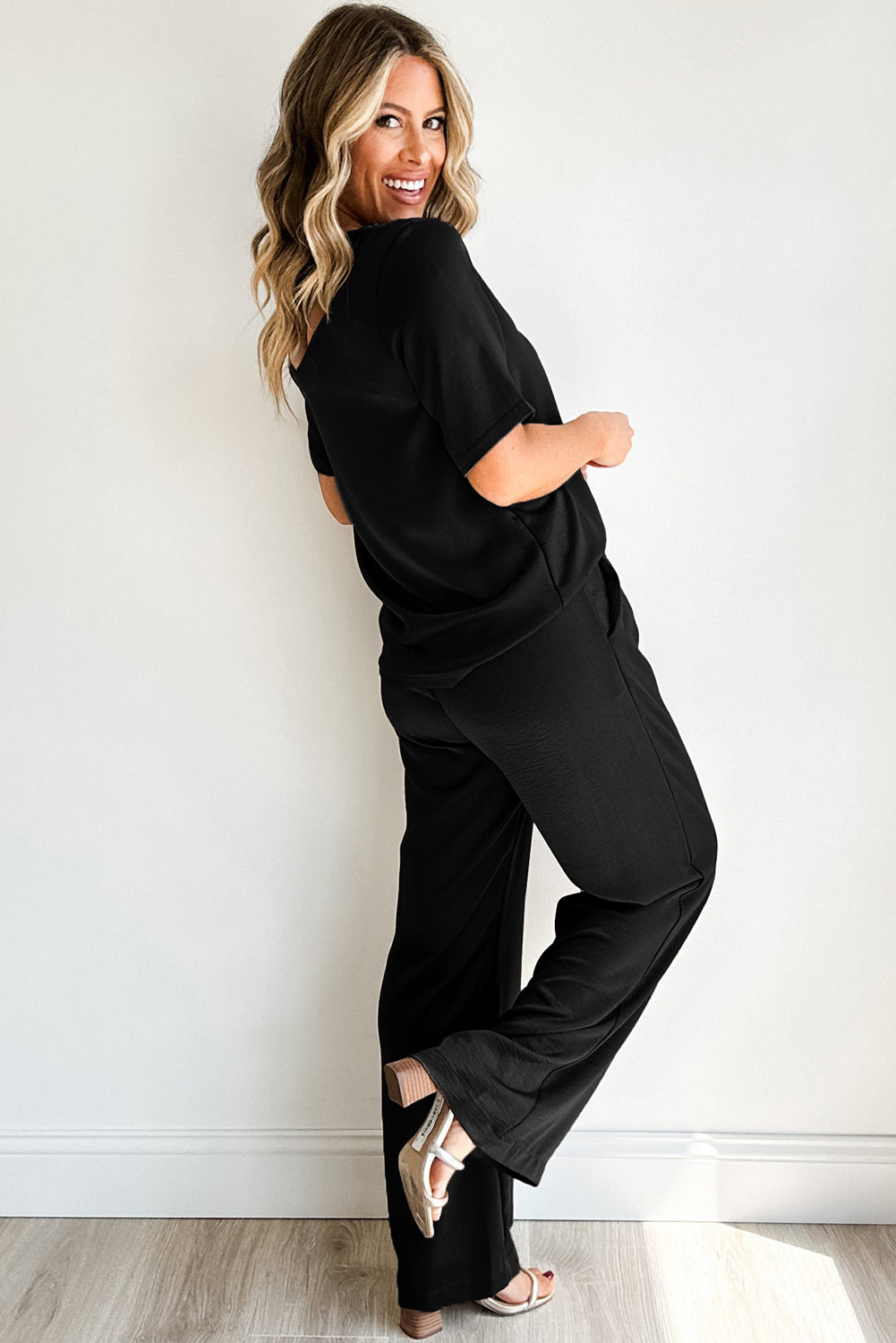 Elevate your wardrobe with our Black Two-Piece Solid Color T Shirt and Wide Leg Pants Set! This stylish set features a flattering black color and comfortable design. Perfect for any occasion, this set will make you look and feel your best. Upgrade your fashion game now!