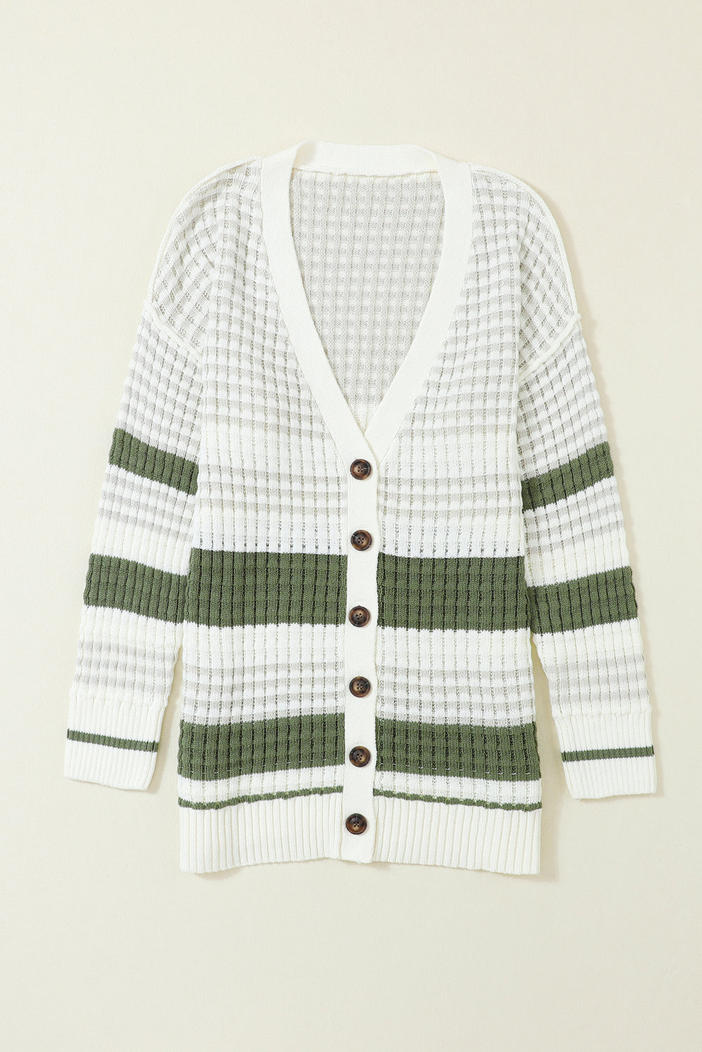 Get ready to add some color to your wardrobe with this Green Colorblock Textured Knit Buttoned Cardigan! The block-striped lightweight weave brings a playful touch to any outfit, while the rows of buttons down the front make for easy layering. Plus, the carefully knitted patterns and ribbed details add a touch of elegance to this quirky and fun cardigan.