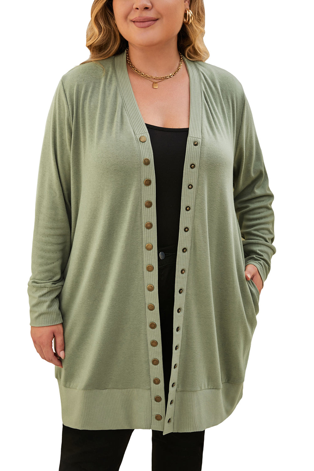 A versatile and dainty addition to any wardrobe, this green plus-size cardigan features a snap-button closure and ribbed trim for a vintage feel. With convenient pockets, it's perfect for adding a touch of warmth while running errands or lounging at home. Pair with a long-sleeve top and skinny pants for a complete casual look. (Fits ladies of all sizes!)