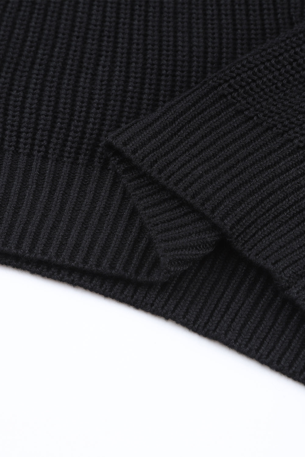 Cozy up in style with our Black Ribbed Knit V Neck Sweater. Made with a soft and stretchy ribbed knit fabric, this sweater features a flattering v neck design. Perfect for pairing with jeans or leggings, it's a versatile and stylish addition to any wardrobe.