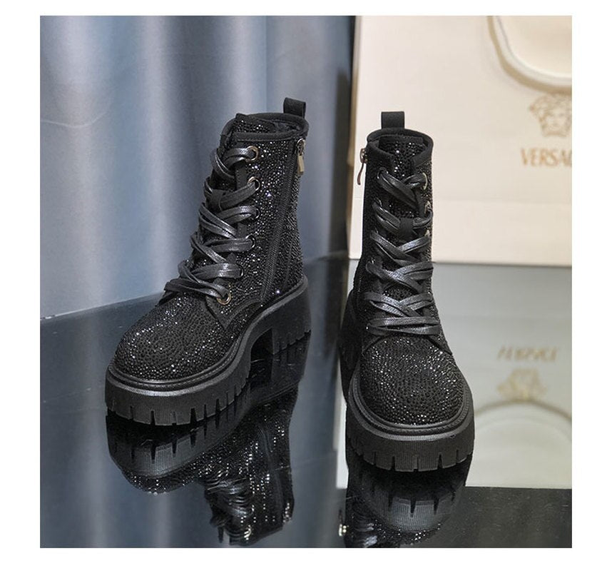 Black rhinestone combat boots.  Step into luxury this season with our New Autumn and Winter Boots. Made from high-quality leather and adorned with sparkling rhinestones, these boots will be sure to turn heads. The round toe and thick bottom provide added comfort, while the increased side zipper and lace-up design make them easy to wear. Elevate your style with our Martin Boots!