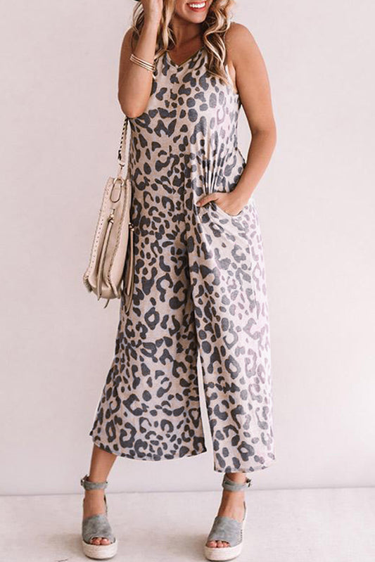 Elevate your style with our Leopard Print Pockets Wide Leg Sleeveless Jumpsuit! Show off your wild side with its bold print and enjoy the comfort of its wide leg and sleeveless design. Plus, stay trendy with the convenience of its pockets. Perfect for any occasion, this jumpsuit is a must-have in your wardrobe!