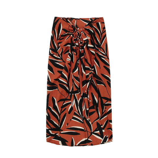 Add a touch of elegance to your summer wardrobe with our one-size-fits-all flowy skirt! Featuring a bold graphic print in red, or a chic tan and black option, this skirt is perfect for any occasion - whether it be a day at the office, a fun evening out, or a casual daytime look. Stay stylish and comfortable all summer long!