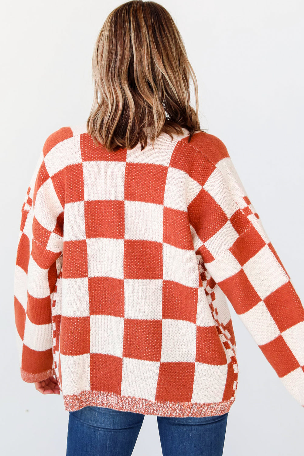 Introducing our Chestnut Mix Checkered Cardigan, a chic and classic addition to any wardrobe. Its checkered pattern is sure to make you fall in love with this knit coat. The open front design makes it easy to layer over any outfit, perfect for pairing with jeans, skirts, or dresses.