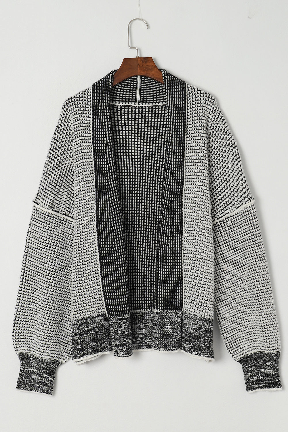 Add some shine to your outfit with our Grey Plaid Contrast Trim Open Front Cardigan. The classic plaid design, open front, and contrast trim make this cardigan perfect for any casual look. Made with soft fabric and a comfortable shift cut, this cardigan can be paired with a tank top, shorts, pants, or leggings for a stylish and cozy ensemble.