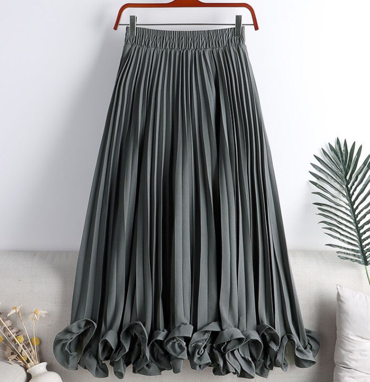 Experience timeless elegance with our Elegant Vintage Irregular Ruffles Pleated Midi Skirt! The high waist and pleats create a flattering silhouette while the irregular ruffles add a touch of vintage charm. The elastic waistband ensures a comfortable fit, making this the perfect addition to your wardrobe. Elevate your style and feel confident in this stunning skirt!