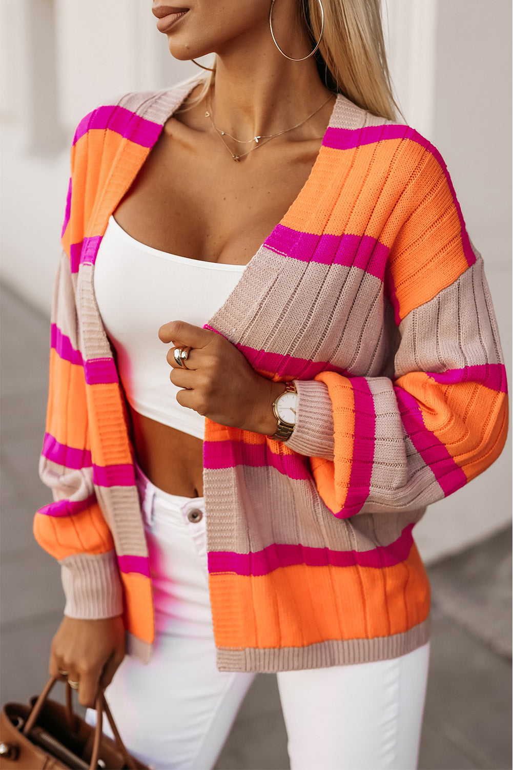 Elevate your fall wardrobe with our vibrant Striped Color block Drop Shoulder Slouchy Cardigan. Made with a casual and comfortable fit, this cardigan adds a modern touch to any outfit. Make a fashion statement with the contrasting colors, perfect for any occasion!